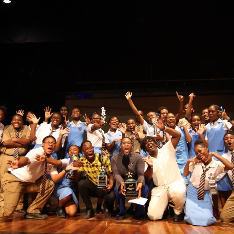 It was all smiles and celebration as Ardenne High School from St. Andrew clinched its record-breaking 14th Marcus Garvey Award for Excellence in the Performing Arts — the highest honour of the Jamaica Cultural Development Commission’s Festival of the Arts Programme. Pictured at centre is Ardenne’s Co-curricular Activities Coordinator, Zia Grey, proudly holding the coveted trophy alongside jubilant students moments after the announcement at the Little Theatre in Kingston.