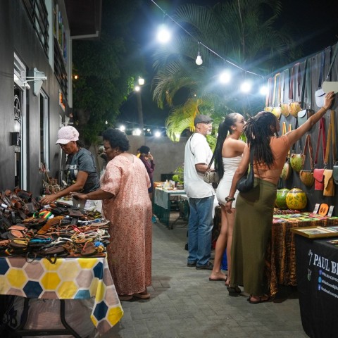 Patrons browse handcrafted jewellery, leather goods and artwork at a previous staging of Kingston Night Market.